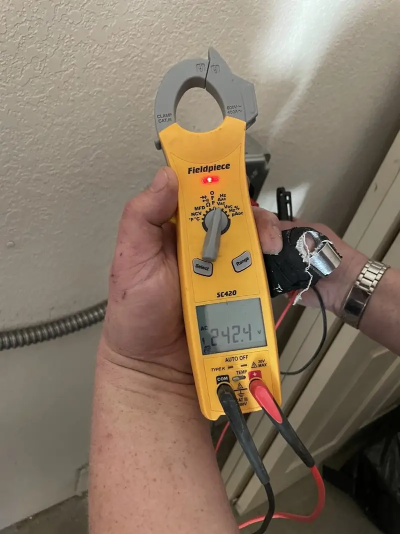 Voltage testing with clamp meter during Electrical Installation Services in West Springfield